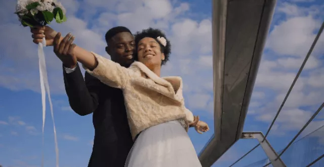 A Couple Standing under the Blue Sky Like Jack and Rose